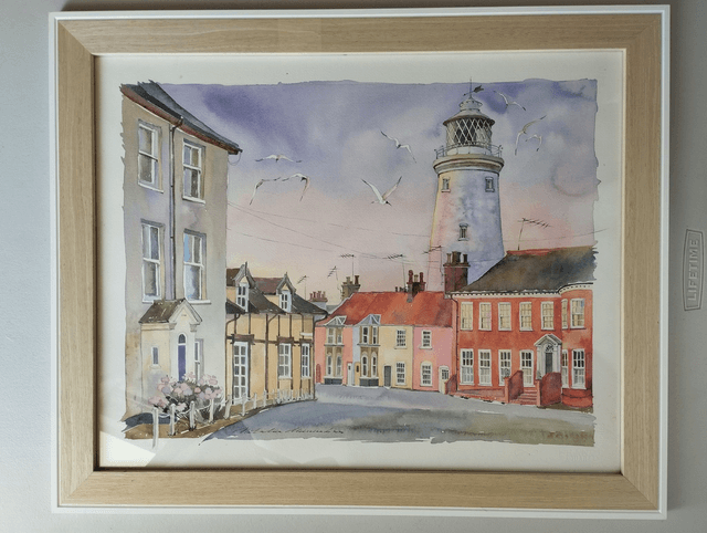 Southwold Lighthouse on sunset lights. Original watercolor