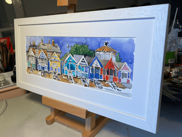 Southwold beach hats under Gunhill. Watercolor in a frame. Original art